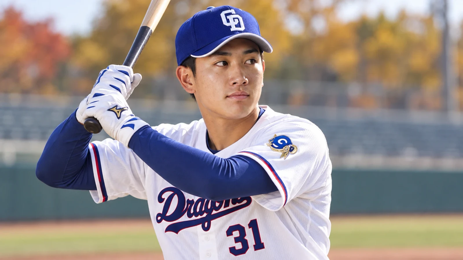 青い帽子と白いユニフォーム姿の野球選手が、手袋をつけてバットを構える姿